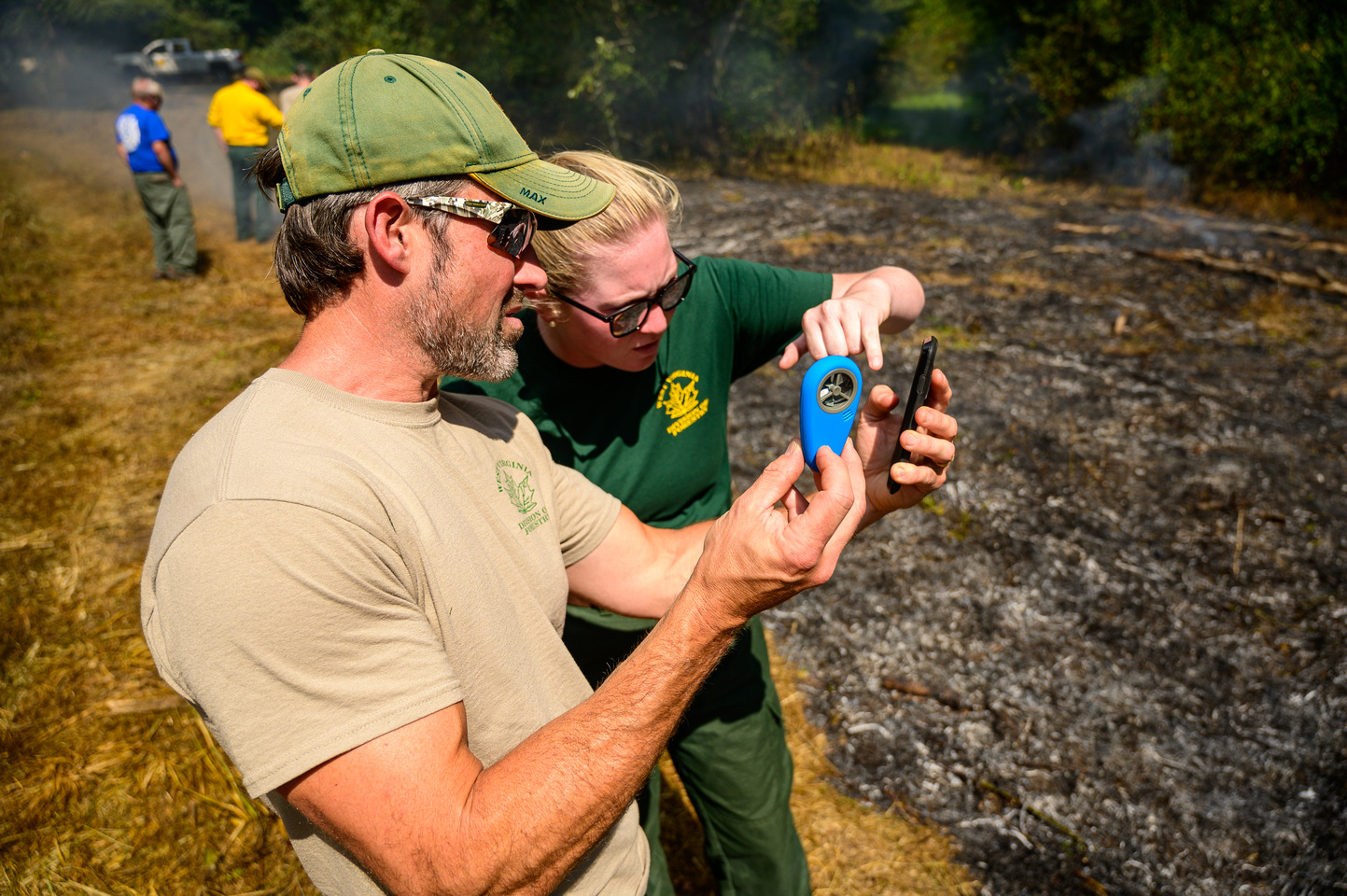 Service Foresters Dan Cooley and Mary Murdock taking weather reading during the investigation of a fire scenario. Used to include or exclude certain causes of wildfires.